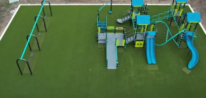 drone-shot-school-artificial-grass-playground Drone shot of artificial grass playground