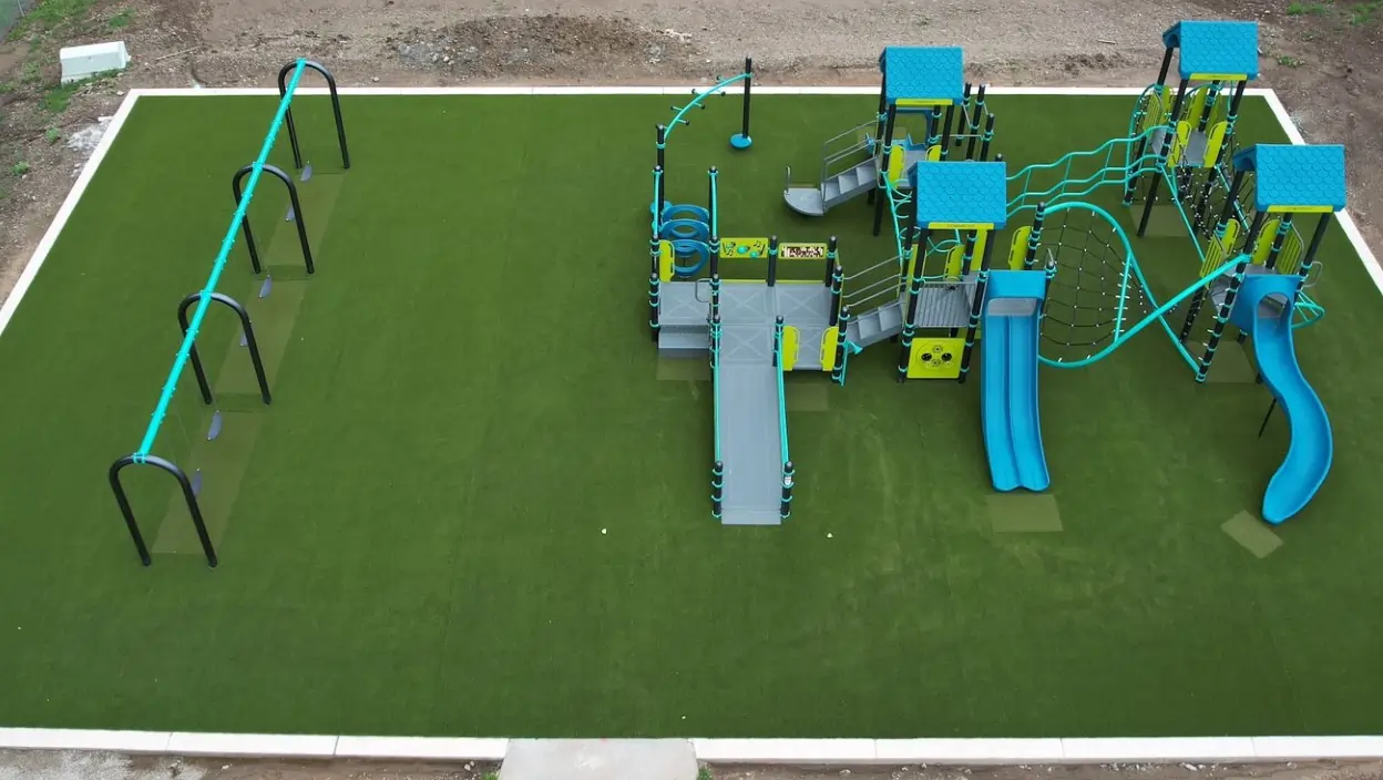 Drone shot of artificial grass playground