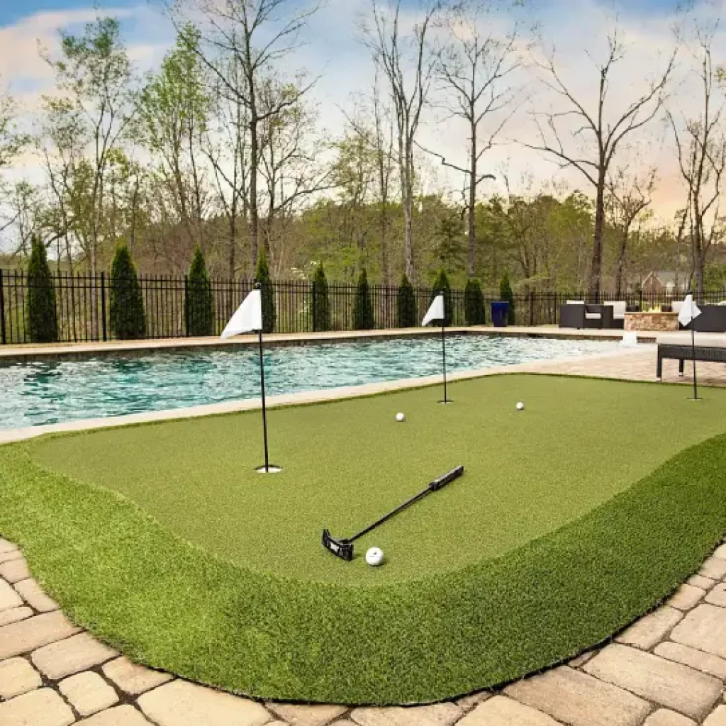 Backyard pool area putting green installed by SYNLawn