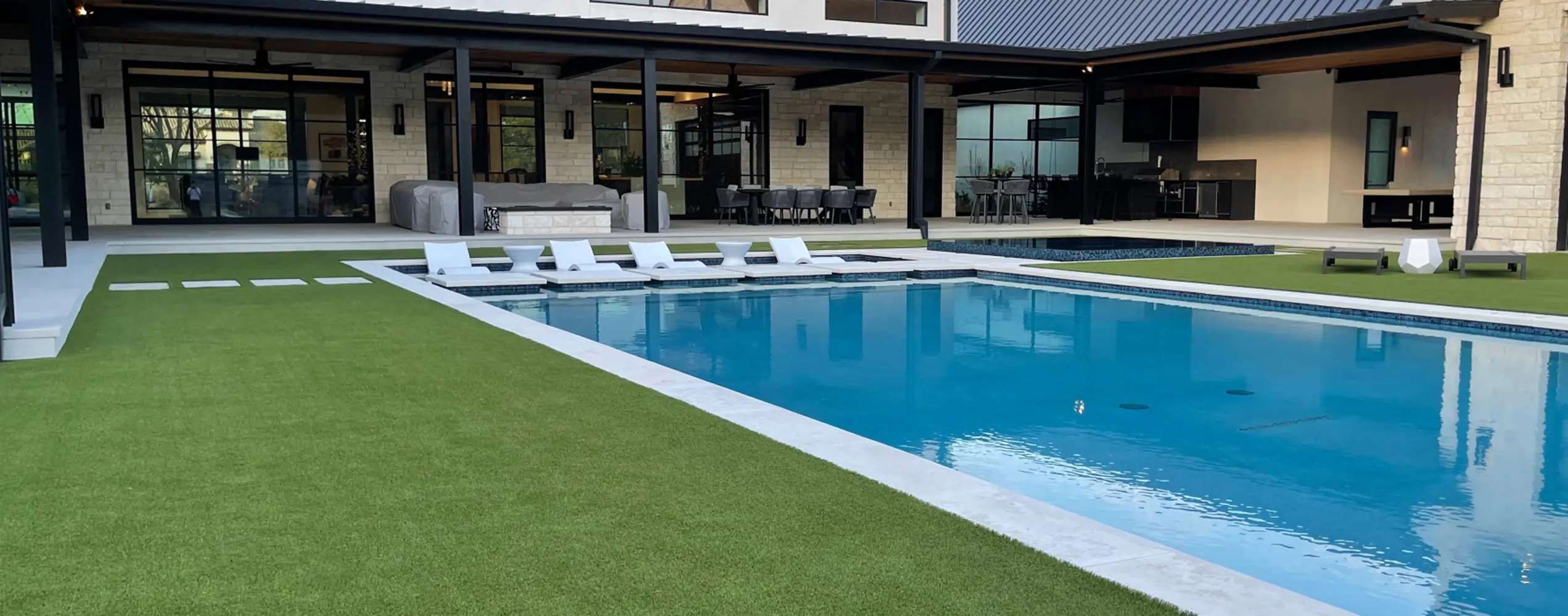 residential home pool with artificial grass
