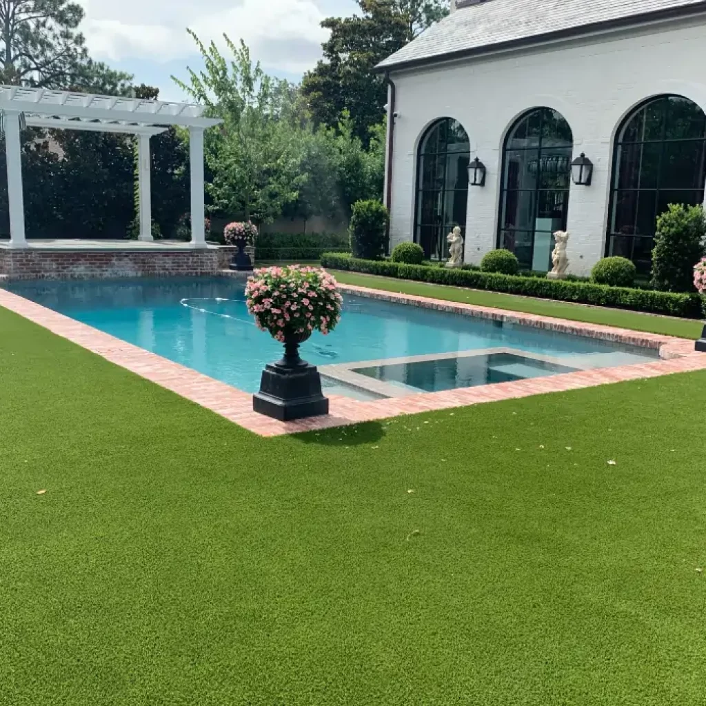 Backyard artificial grass pool deck installed by SYNLawn